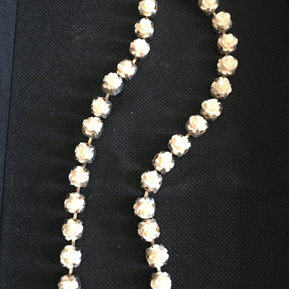 white roses necklace on silver